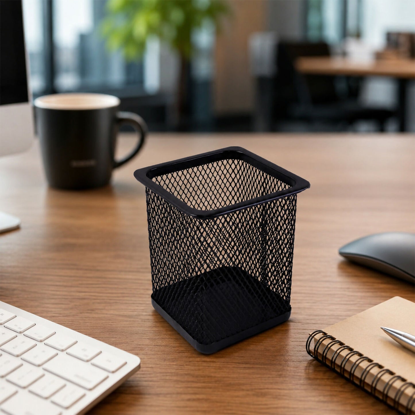 Side view of metal mesh pen holder filled with pens