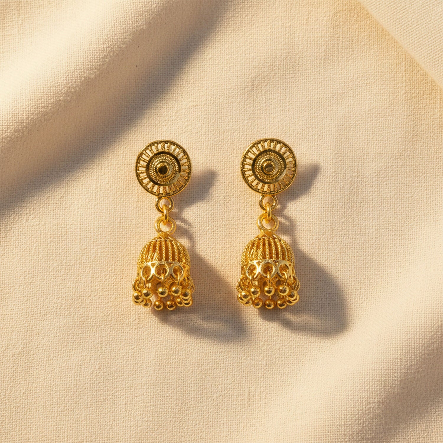 Traditional gold plated jhumka earrings from side angle