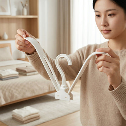 Space saving clothes hanger folded