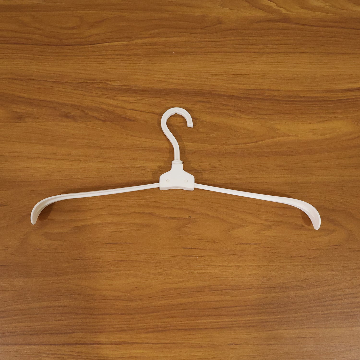 Plastic foldable garment hanger in use