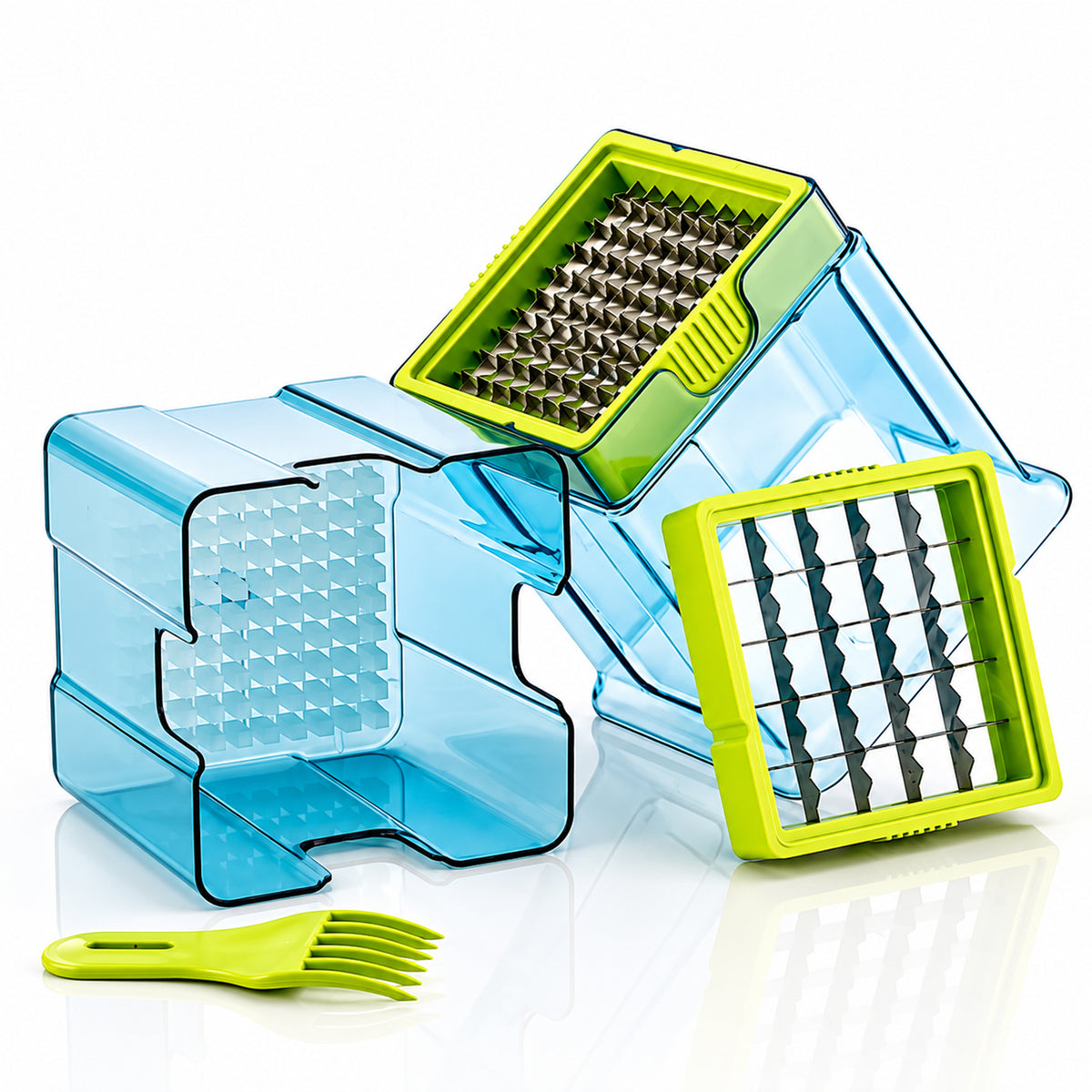 The blue and green plastic vegetable chopper is disassembled, showing two blade inserts and a cleaning fork.
