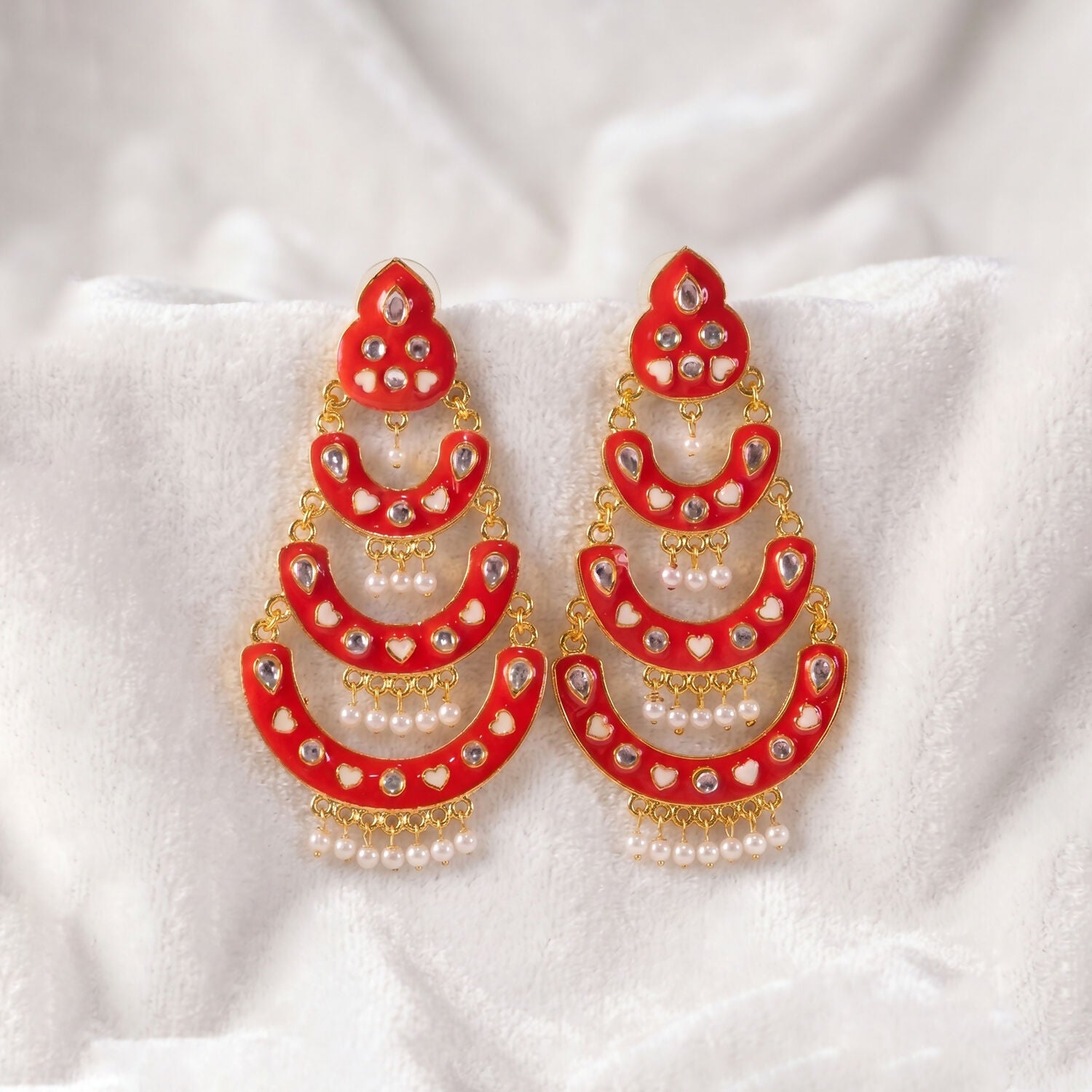 Full view of layered Chandbali earrings with heart-style accents