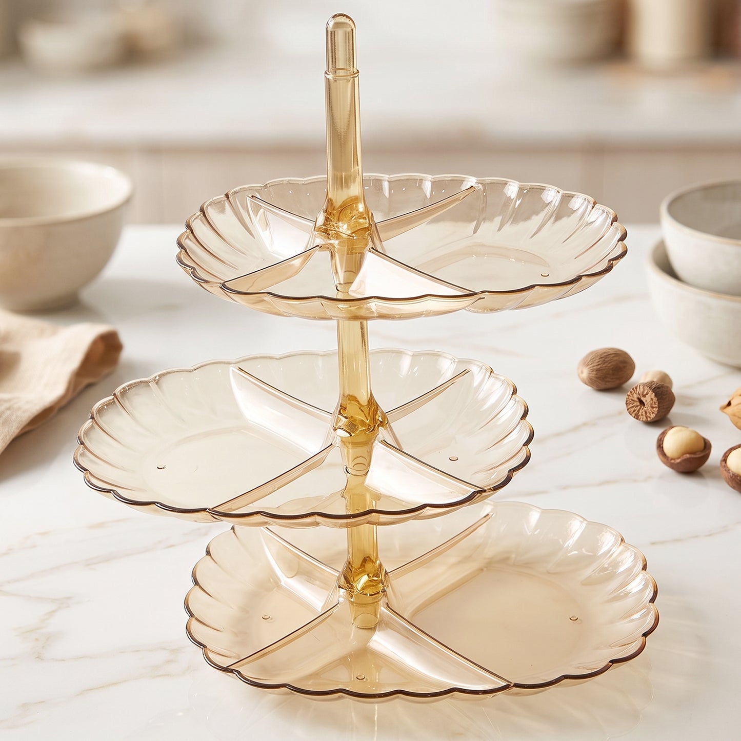 Serving stand filled with snacks at a party table