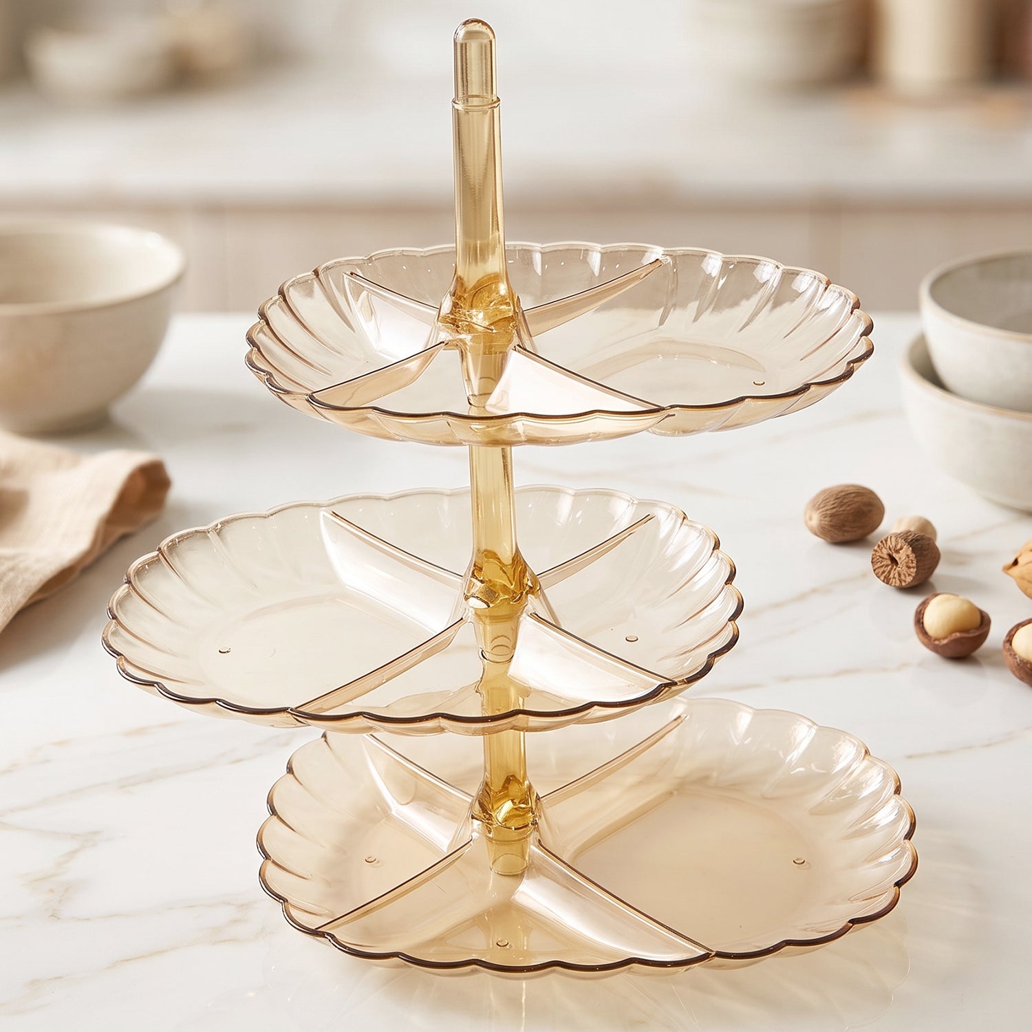 Serving stand filled with snacks at a party table