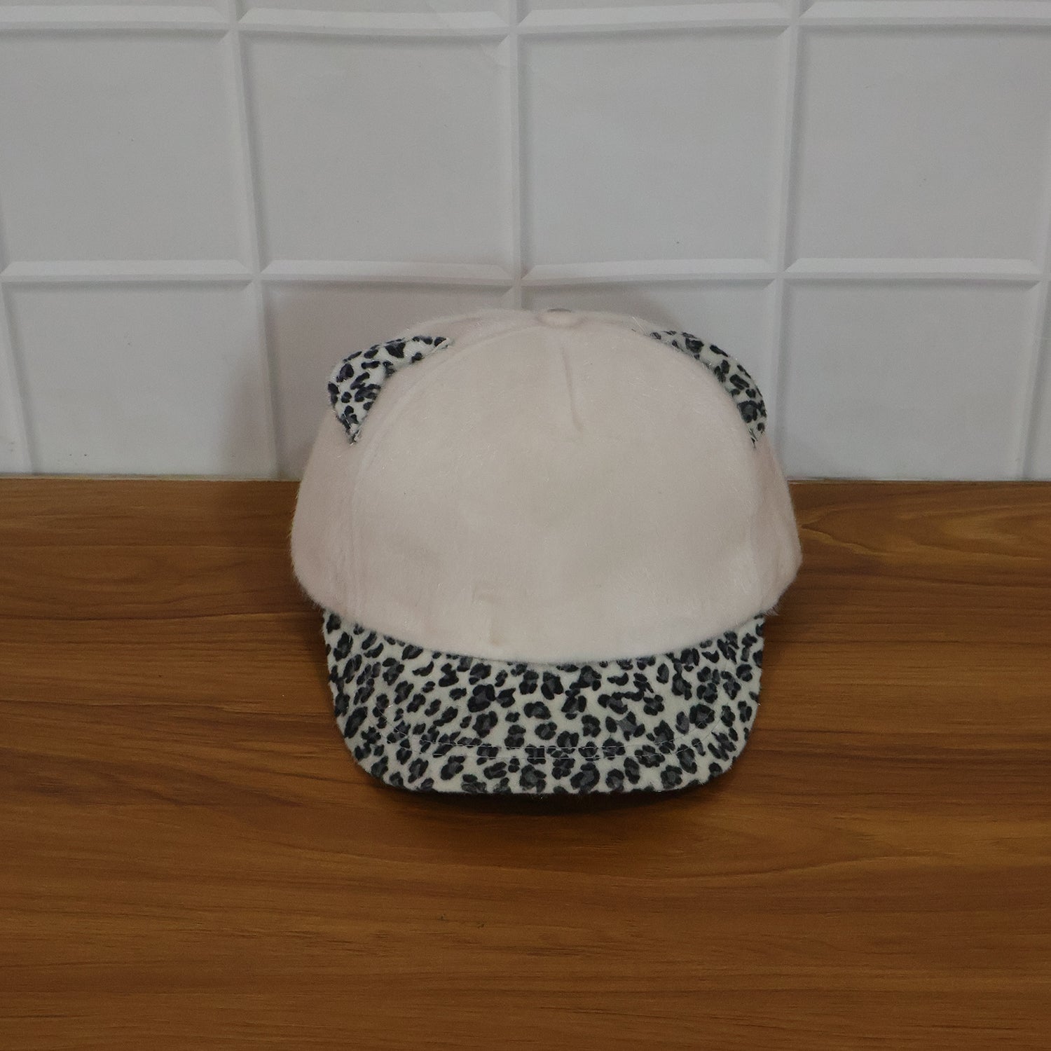 Cat ear cap shown worn outdoors