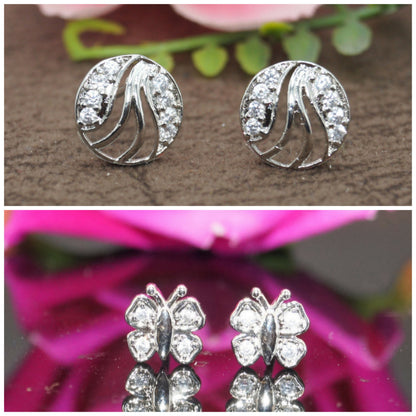 Two pairs of silver plated American Diamond stud earrings featuring abstract round and butterfly designs