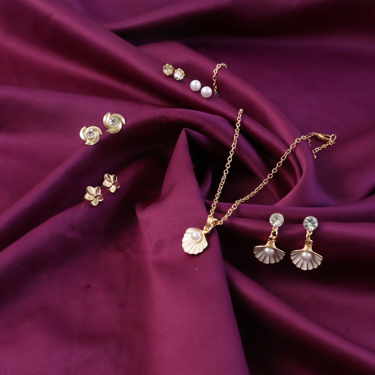 Elegantly crafted gold-plated shell pearl drop earrings from the combo set