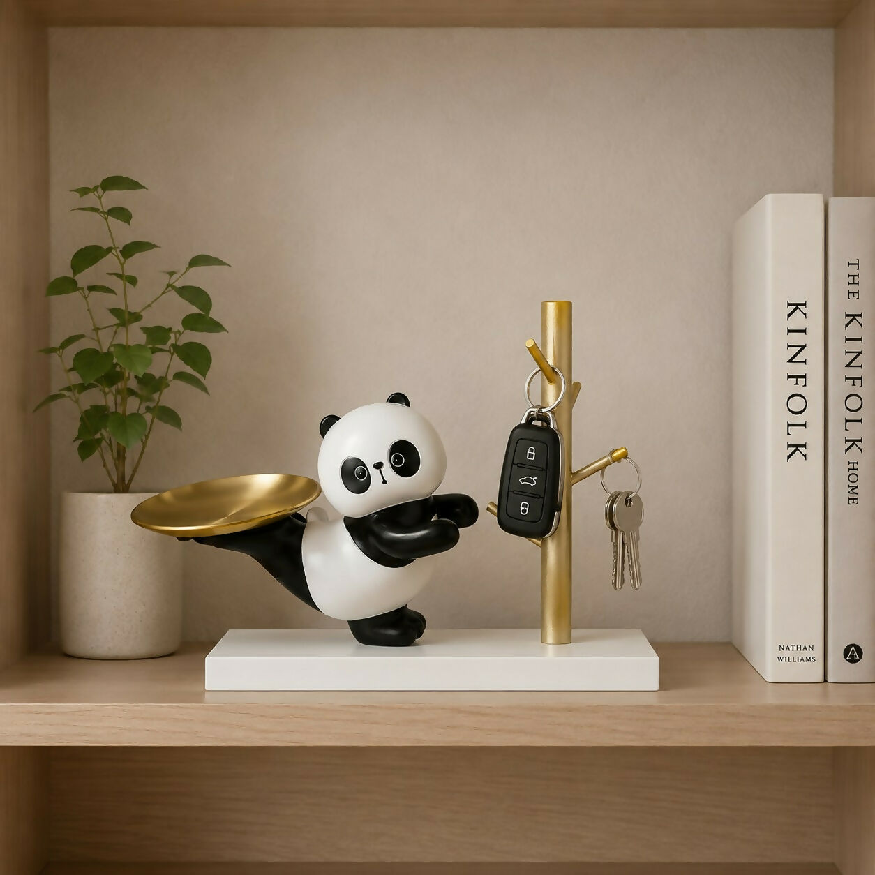 Adorable panda showpiece with tree-style hooks for keys and jewelry.