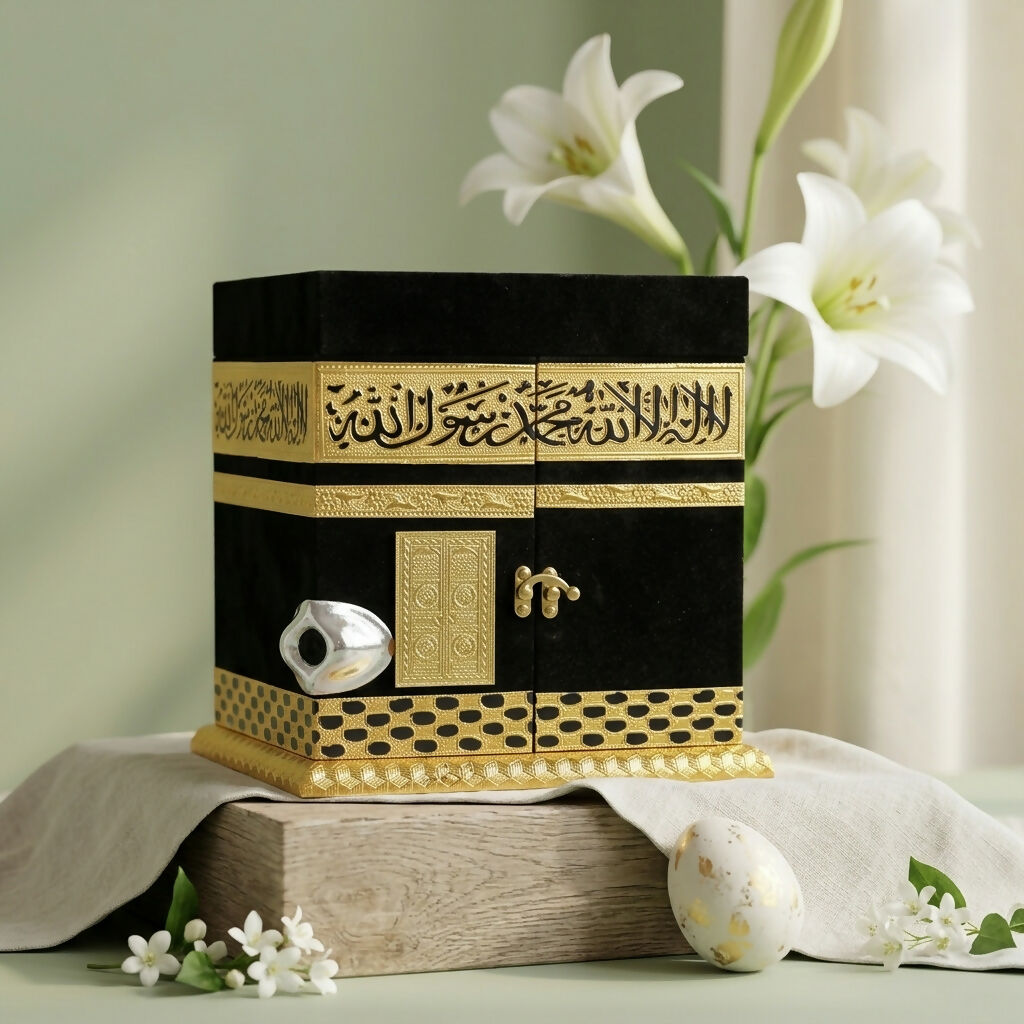 Silver-toned Hajar al-Aswad replica on velvet Kaaba model