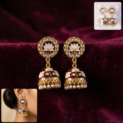 Maroon lotus design gold-tone jhumka earrings with pearl beads, front view