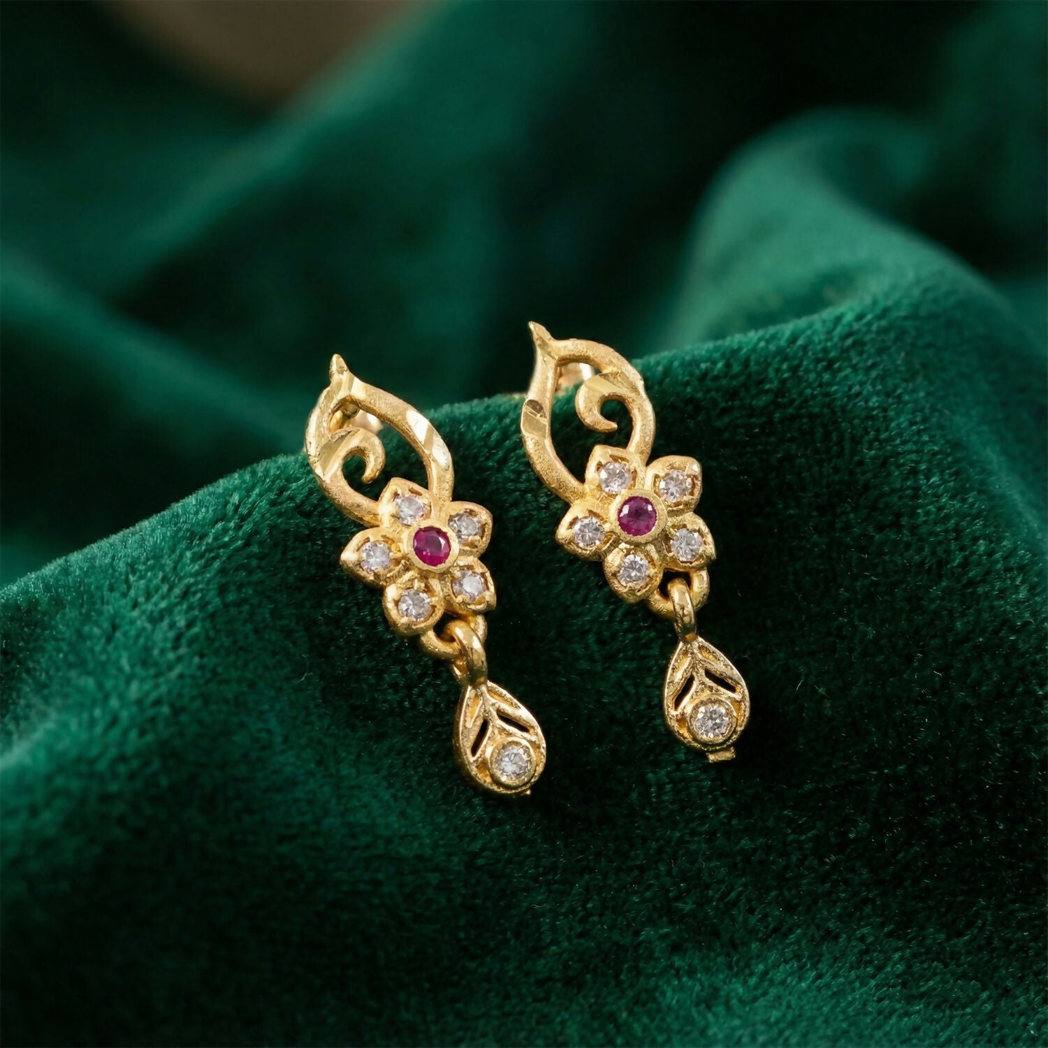 Traditional Floral Gold Earrings With Ruby Center Stone And Leaf Shaped Drop Detail