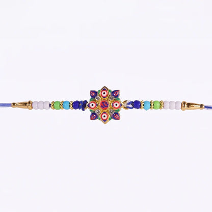 Side view of the protective Evil Eye OM Star Rakhi with comfortable thread.