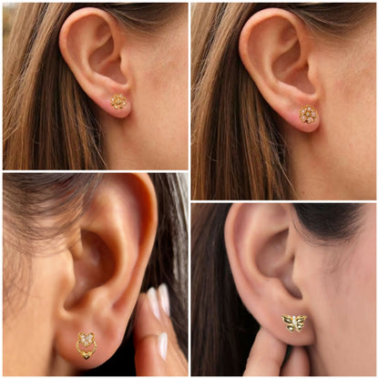 Close-up of gold plated heart stud earrings with cubic zirconia stones