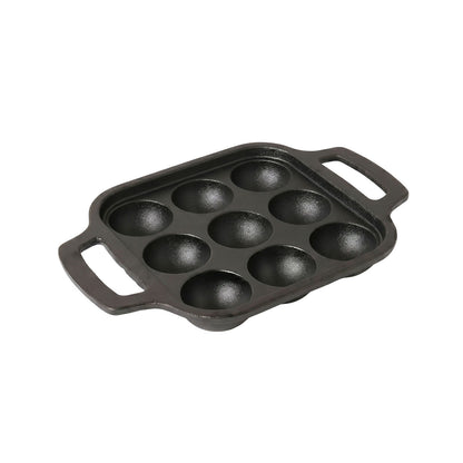 Cast iron appam patra pan with snacks cooked in cavities