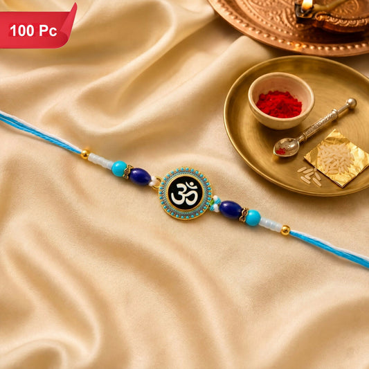 A blue and white Om symbol bracelet with gold, blue, and white beads rests on a shimmering golden fabric.
