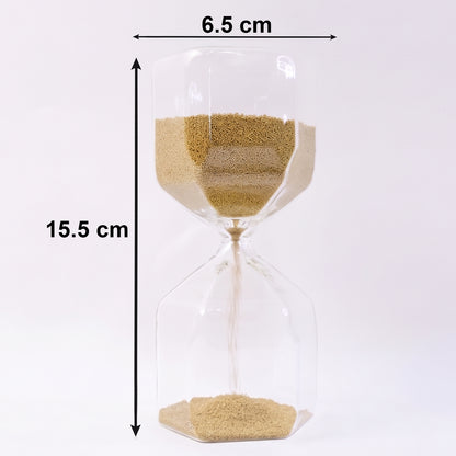 Glass hourglass sand timer showing smooth sand flow