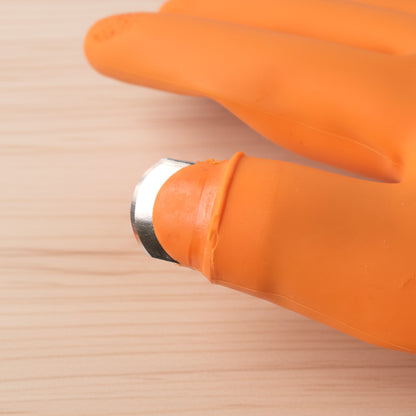 Silicone gloves protecting hands during kitchen food preparation