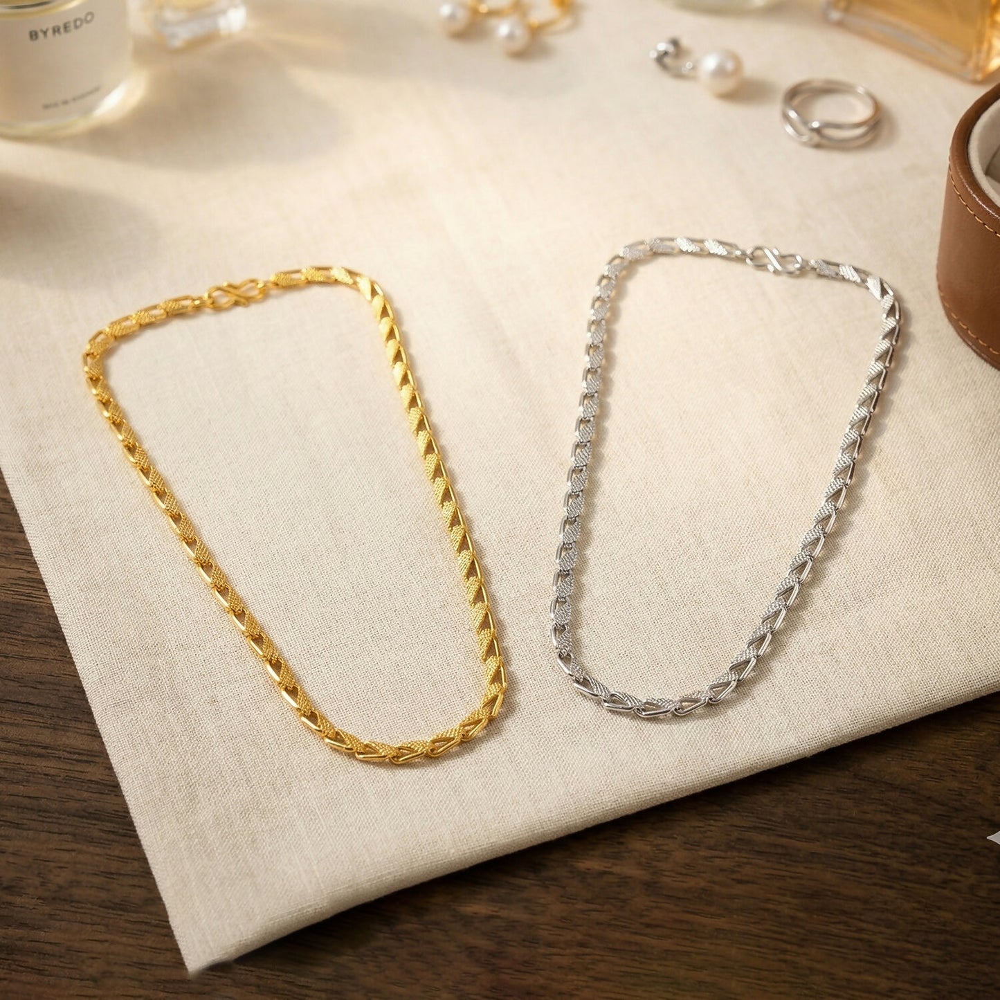 Close-up of interlocking links of dual tone chain necklace