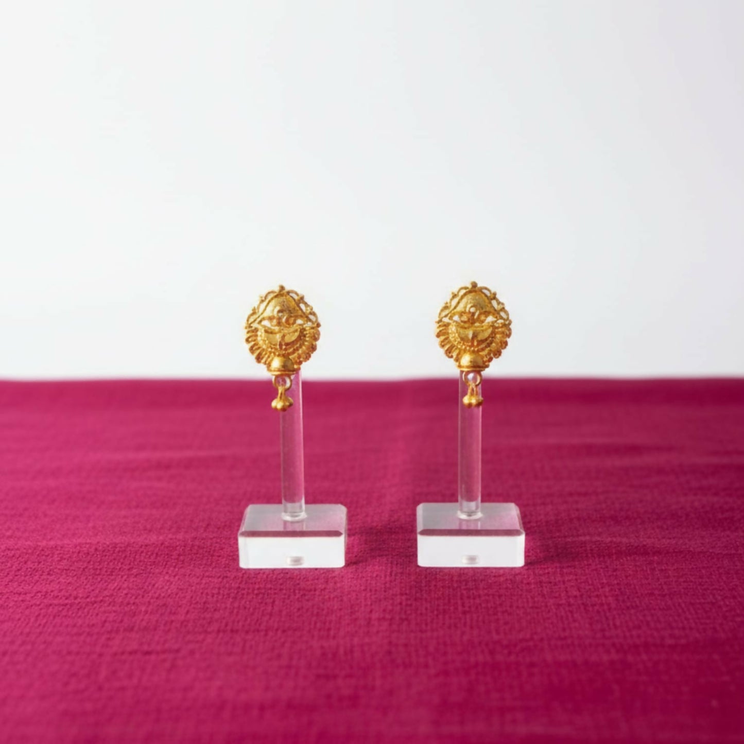Front and side view of lightweight gold-plated jhumka earrings for women