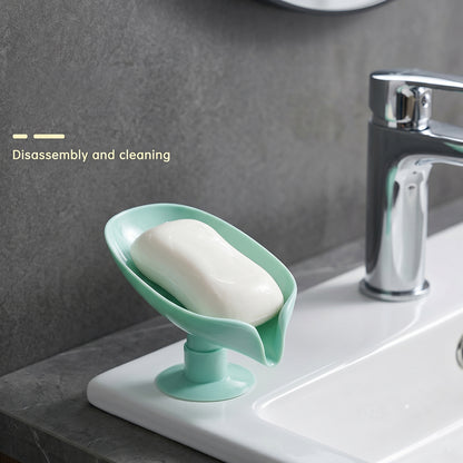 Stylish leaf-shaped suction cup soap holder in bathroom setting