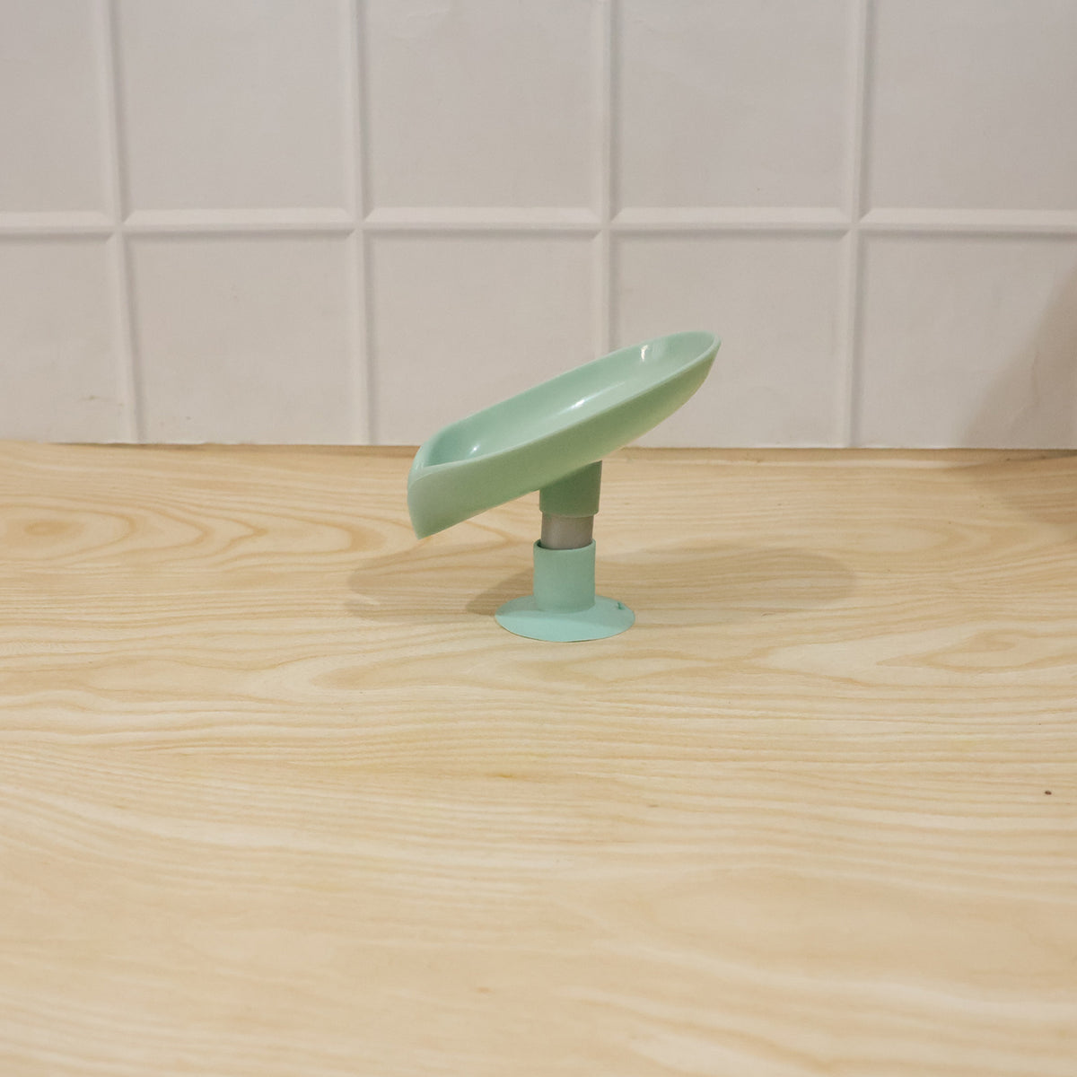 Waterproof plastic soap holder, wall mounted with suction cups in a bathroom environment