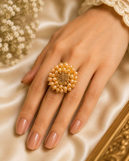 Close up view of the intricate pearl floral design on the gold plated statement ring.