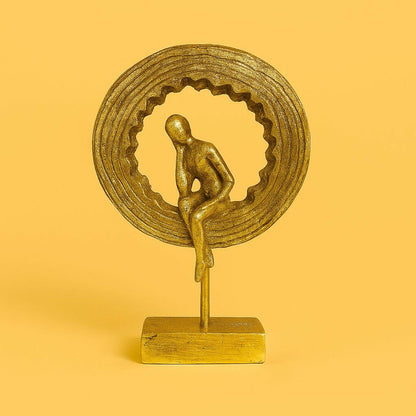 Decorative golden thinking man sculpture close up