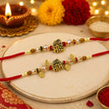 Regal Gold-Plated Hindi Script "भाई & भाभी" Peacock Feather Rakhi Set