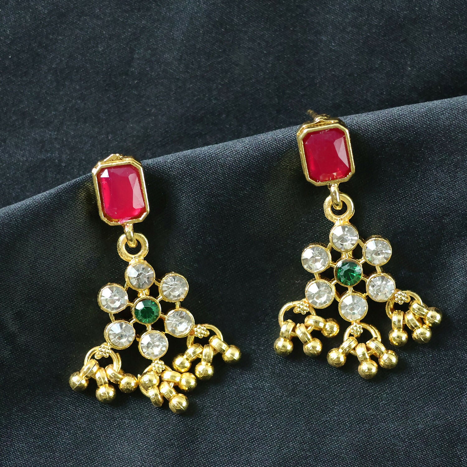 Close-up of intricate floral motifs on gold necklace