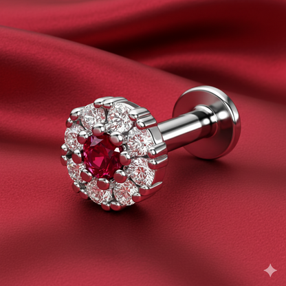 Close-up of ruby center surrounded by diamond halo on silver plated flower flat back earring