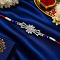 Premium Crystal Floral Designer Rakhi with Blue Beads & Red Thread for Brother