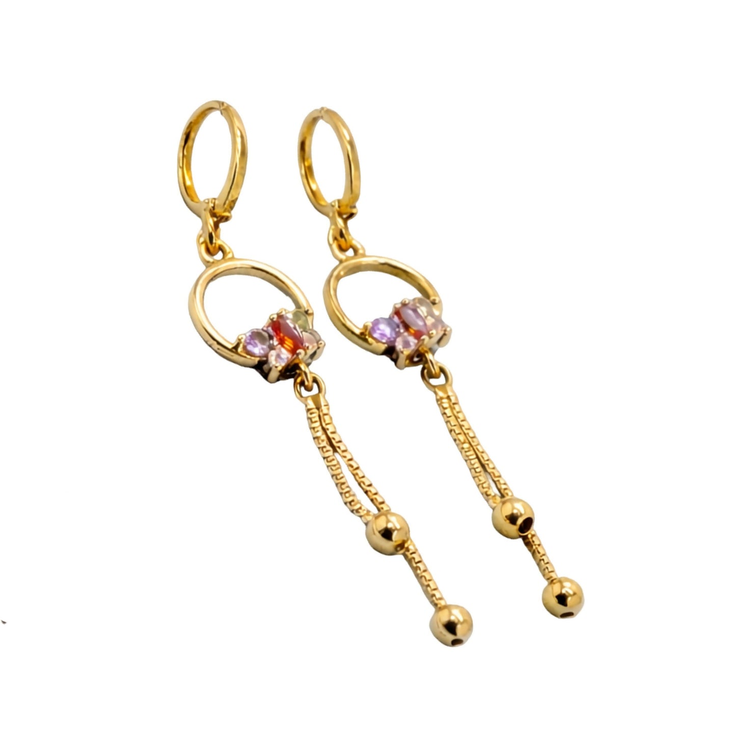 Model wearing gold finish circle drop earrings with colorful stones and tassel chain details
