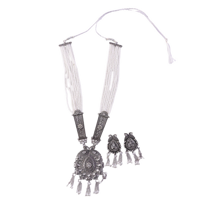 Pendant detail on pearl necklace