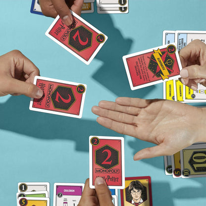 Players enjoying a game of Harry Potter Monopoly Deal cards