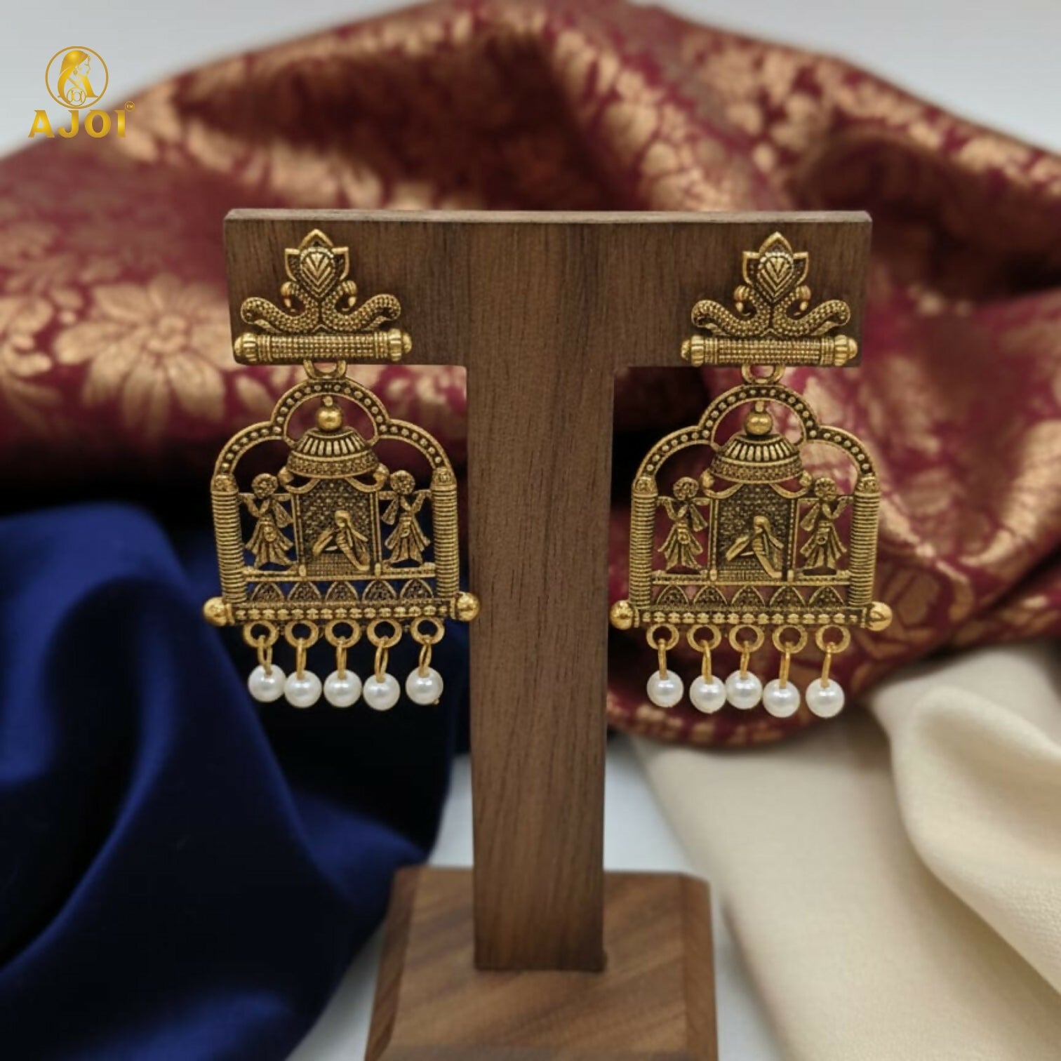 Pearl danglers on Royal Doli Motif gold-tone temple earrings