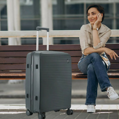 Side view of black 28-Inch hard shell luggage showcasing durable polypropylene surface