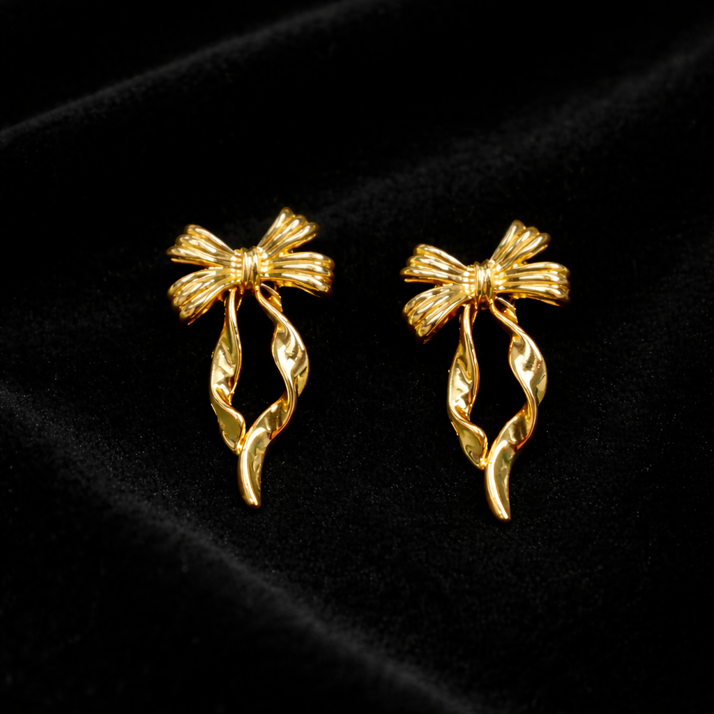Elegant gold bow earrings side view