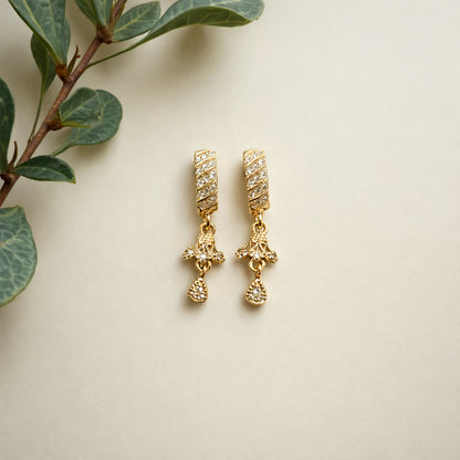 Side view of Spiral Bar Dangle Earrings showing intricate central motif and teardrop stone