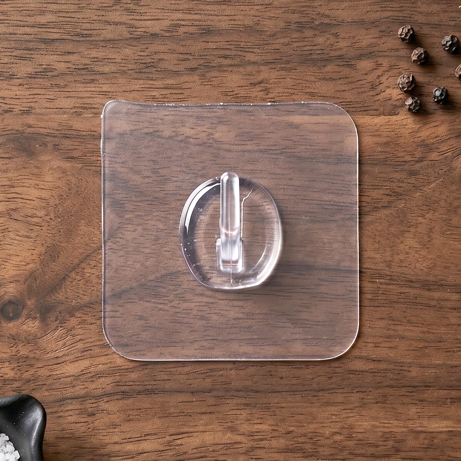 Clear Stick-On Wall Hook in use