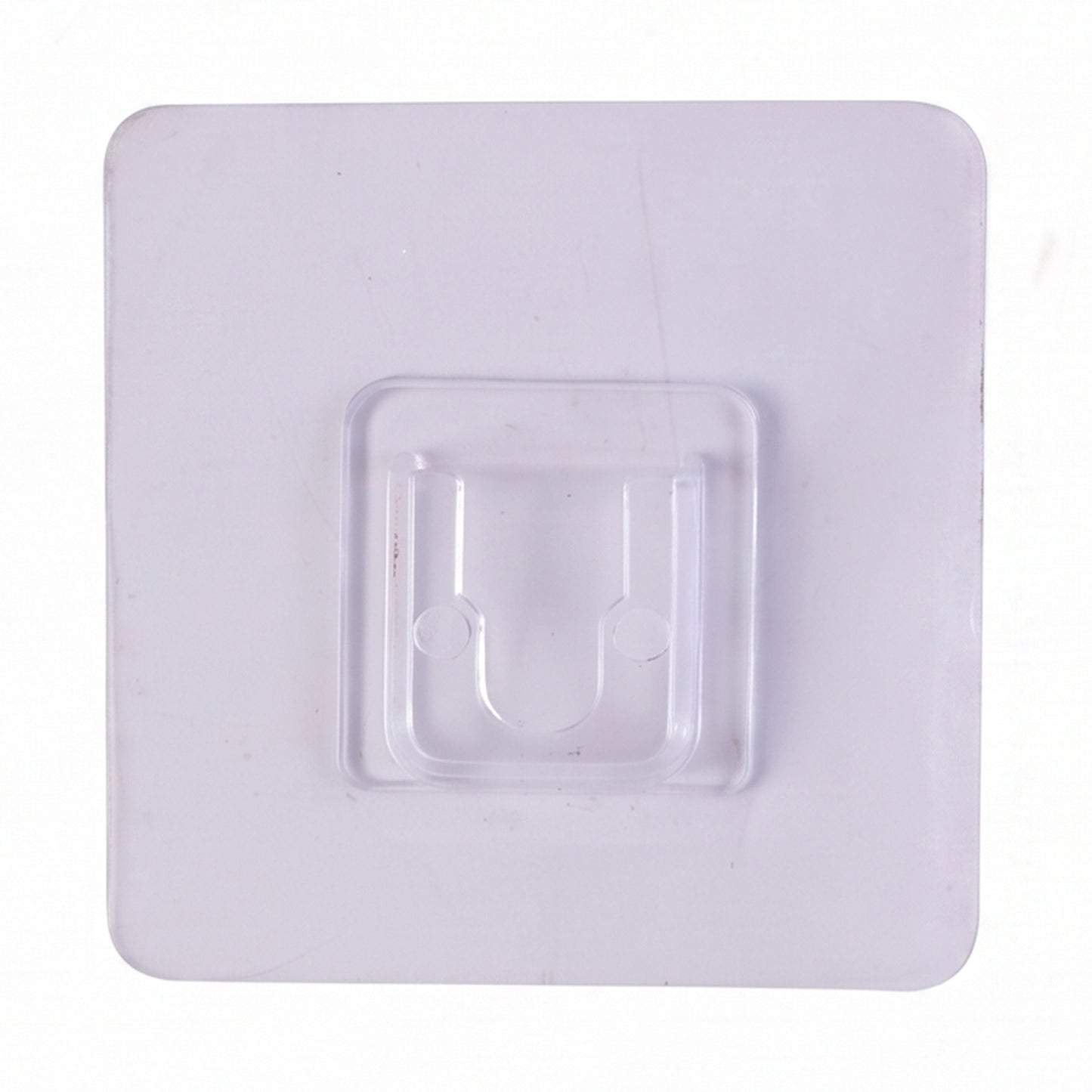 Transparent wall hook attached to a smooth surface for organization.