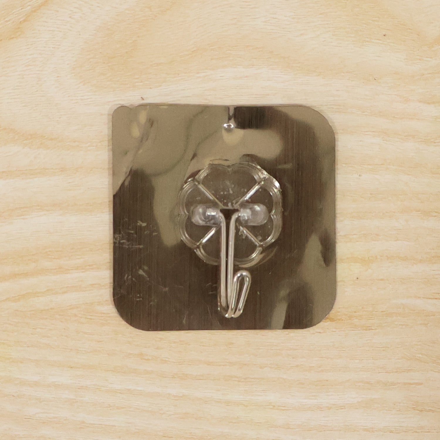 Self adhesive metal floral wall hook on smooth surface