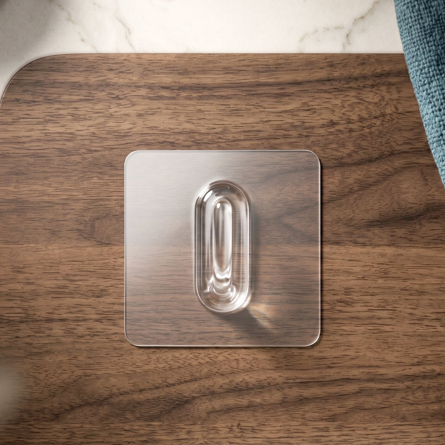 Side view of clear adhesive wall hook