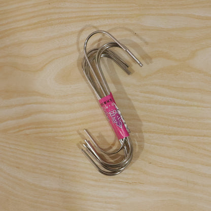 Versatile S hooks hanging from a rack, holding bags and supplies.