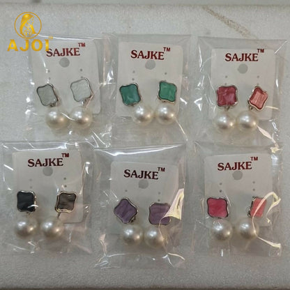 Colorful enamel stud and pearl drop earrings highlighting design details