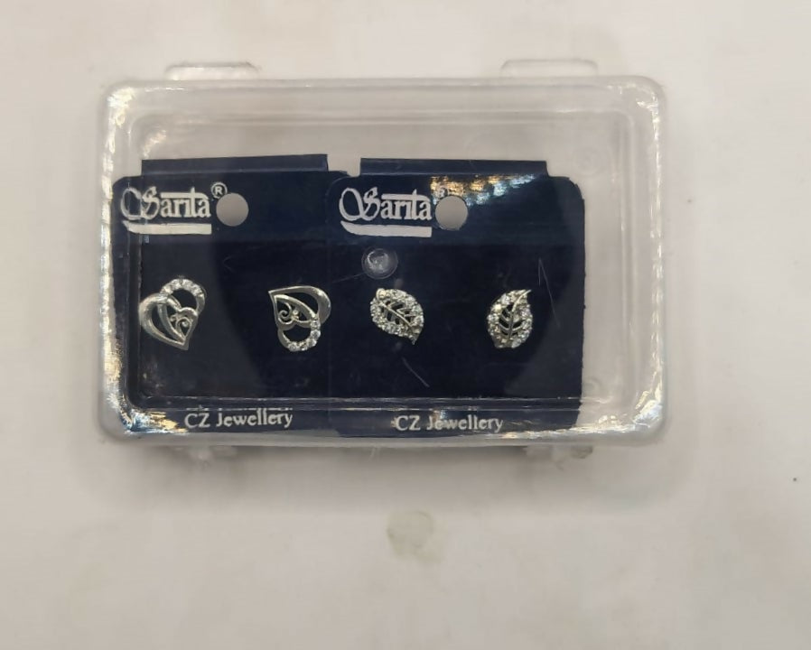 Silver-plated heart and leaf stud earrings showcased on jewelry display stand