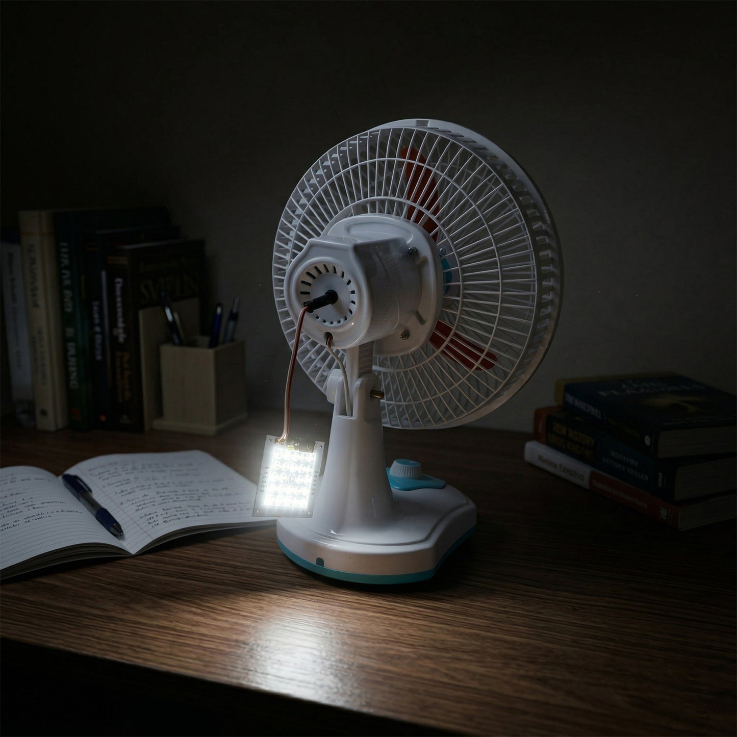 Electric table fan with LED light for emergency use