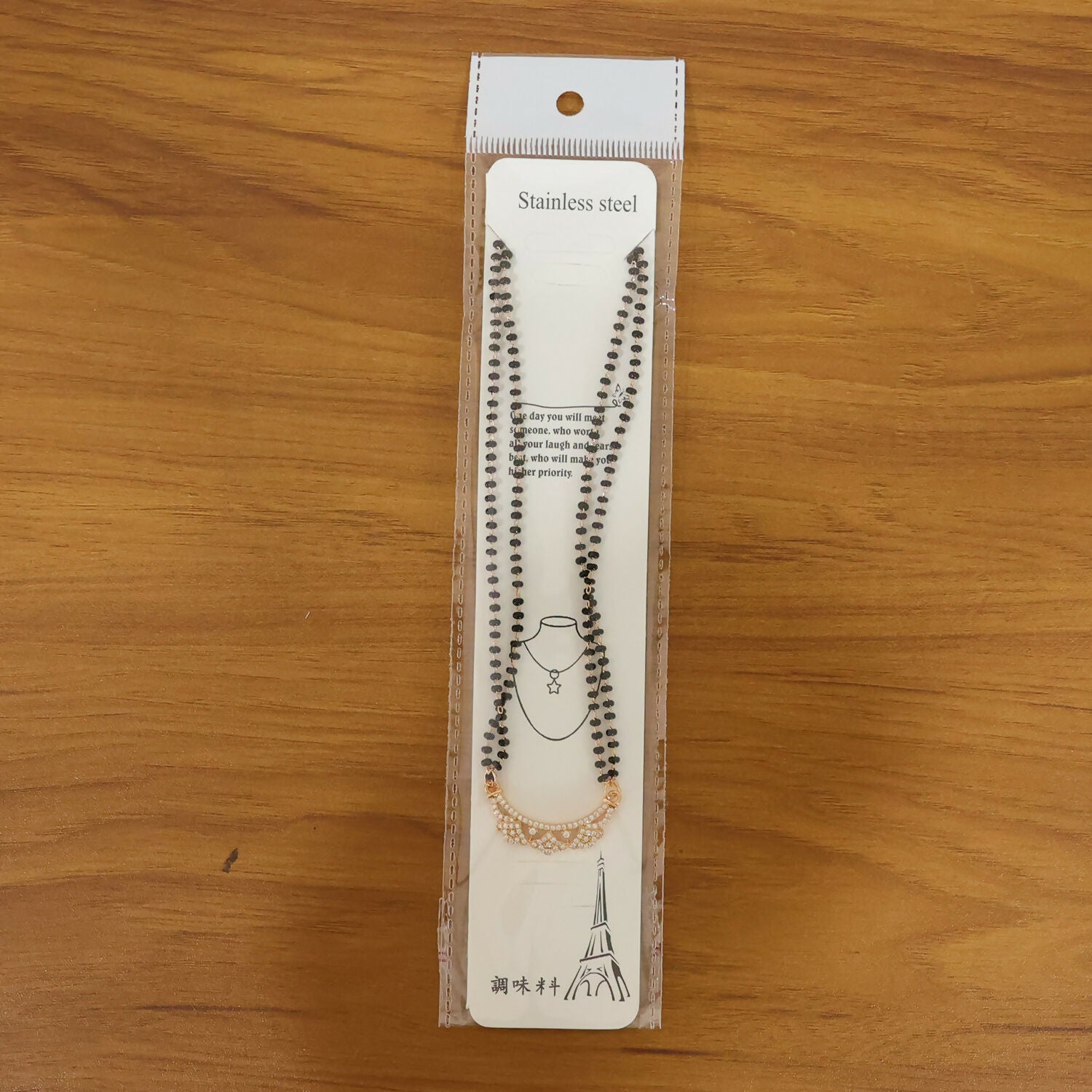 Elegant mangalsutra styled with black bead chain and delicate floral pendant