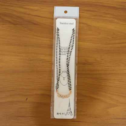 Elegant mangalsutra styled with black bead chain and delicate floral pendant
