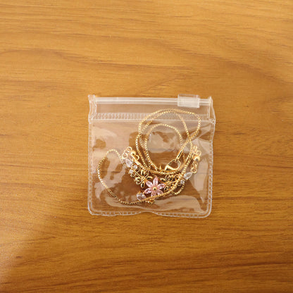 Luxury pink floral pendant necklace with elegant gold finish and crystal drop shown on a model