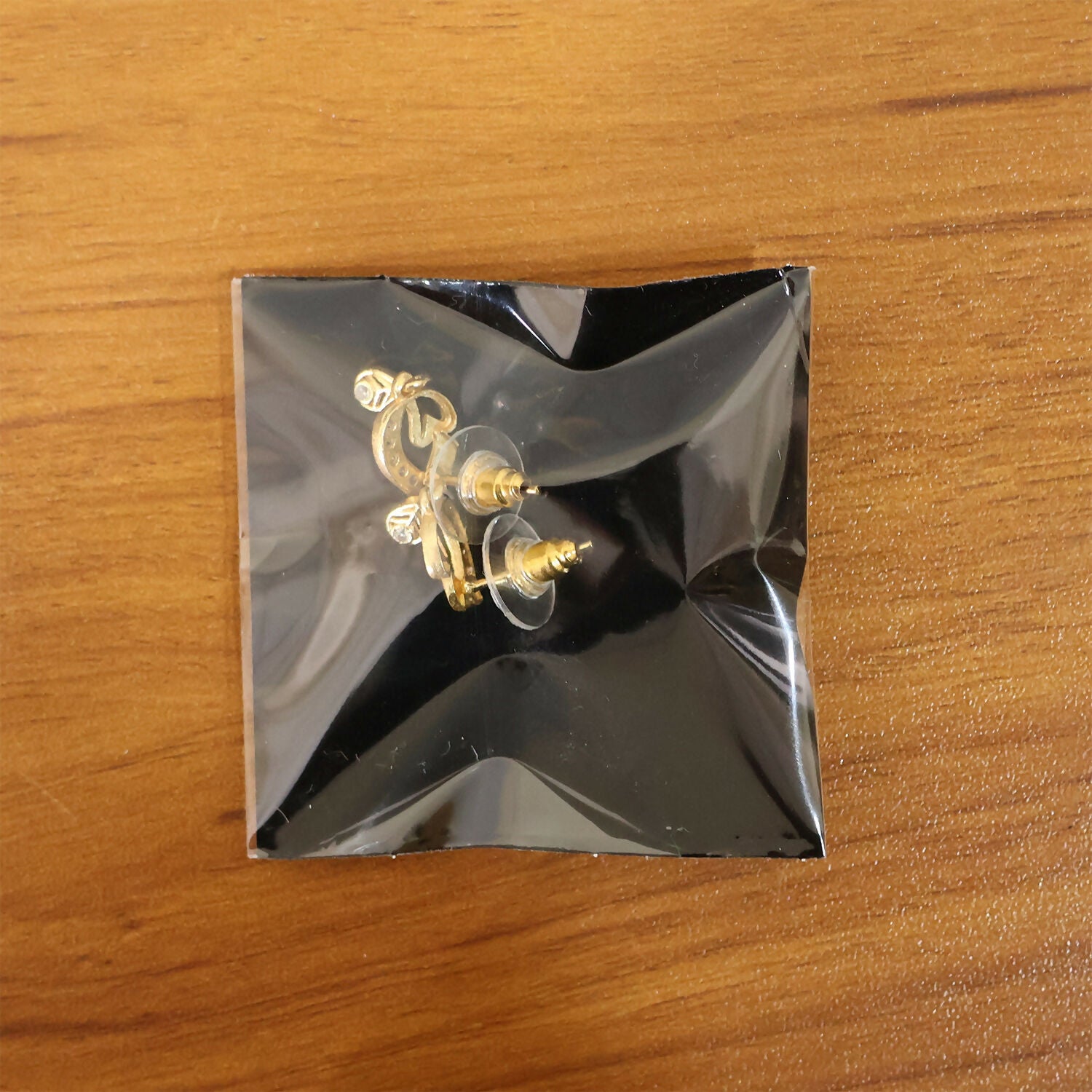 Artistic Leaf Motif Gold Stud Earrings With Crystal Highlights And Drop Finish